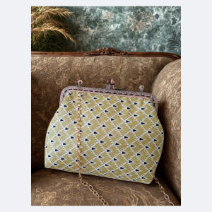 Sac à main rétro jaune et noir avec fermoir et chainette
