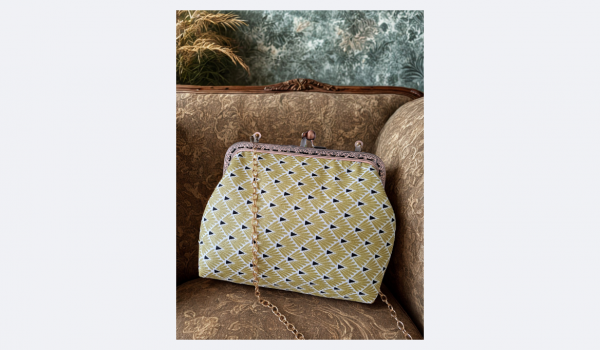 Sac à main rétro jaune et noir avec fermoir et chainette