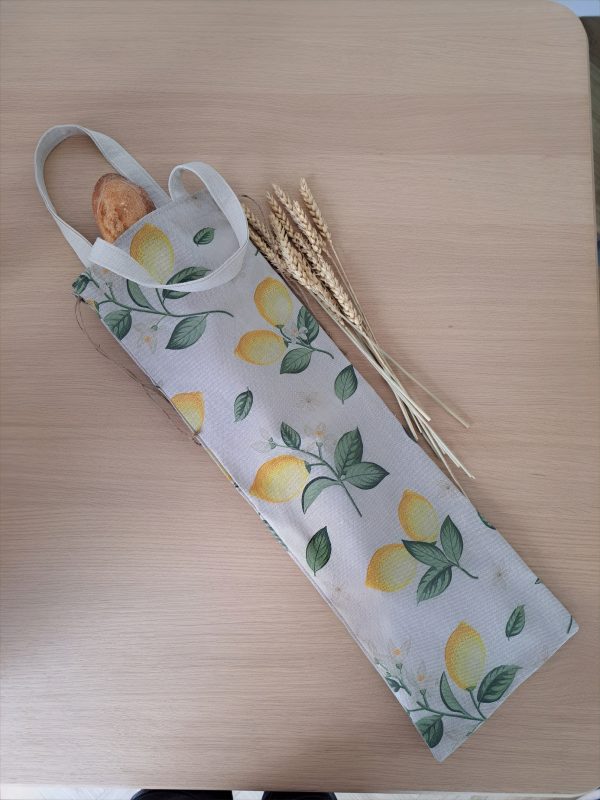 Sac à pain artisanal Petit Citron ouvert, motif citrons jaunes, grande ouverture permettant d’y glisser facilement le pain, réutilisable pour remplacer les emballages jetables.