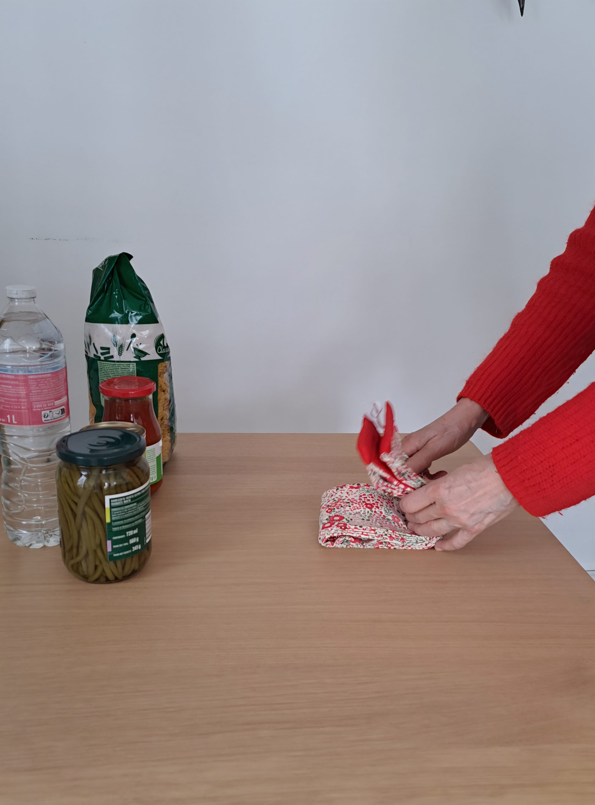 Vue détaillée du système de pliage compact du sac Pli Vite en coton, montrant le pliage pour un rangement facile.