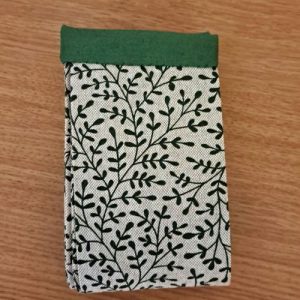 Sac en coton Pli Vite Botanique avec motif floral, système de pliage rapide par traction et conception ergonomique anti-frottement au sol.