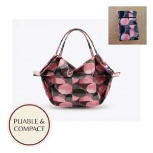 Sac Miette Mini Loop ouvert avec insert montrant version pliée compacte et badge pliable et compact, motifs géométriques roses et noirs sur fond blanc studio